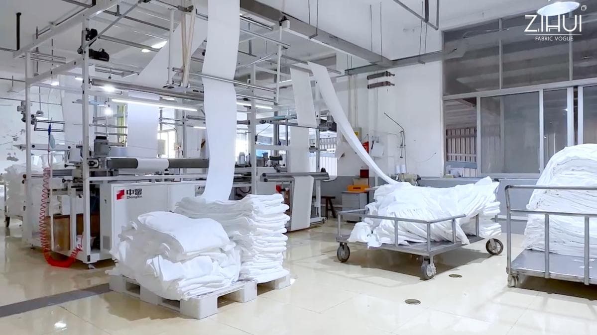 Bright ZIHUI linen production workshop with textile equipment and finished bedding